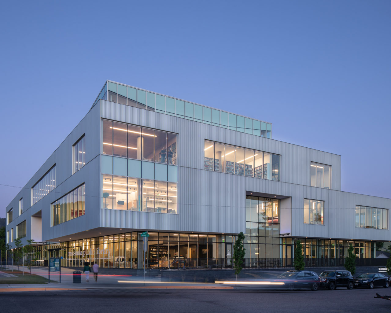 Exterior view of the Missoula Public Library at dusk.